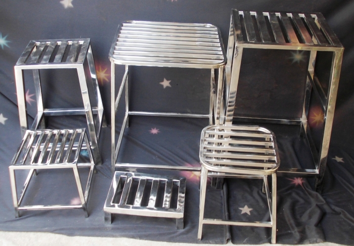 Stainless Stools And Tables In Different Sizes And In Different Shapes